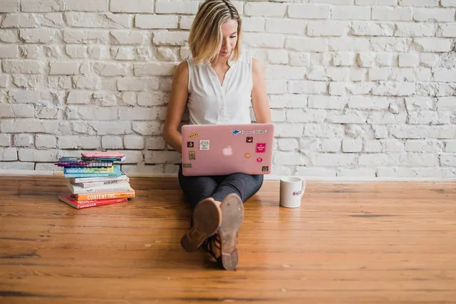 influencer, writing, girl, woman, typing, on computer, content marketing, typing on floor, written, words, handwriting, brown computer, brown laptop, brown marketing, brown writing. Content Distribution Guide for Business Teams